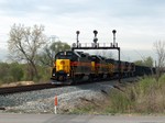 A shot of CBBI-19 on April 21st, 2005 at Houbolt Rd. in Joliet, IL making a crew change.  The Rock Island signal bridge still stands as-is today.  Photo by Joe Kaminskas.