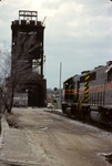 602 and 627 roll westward approaching Bridge 407 at Joliet in March of 1998 with the classic Rock Island signal beckoning him on.  Photo by Dan Tracy.