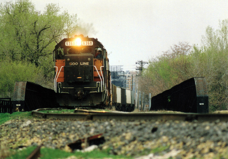 IAIS engineer Tom Frances pilots a Soo Line train over Arsenal Island on April 27, 1993, when Soo Line trains detoured over IAIS between Missouri Division Junction in Davenport, IA and Rock Island, IL during the Flood of 1993. Todd Pendleton #2.