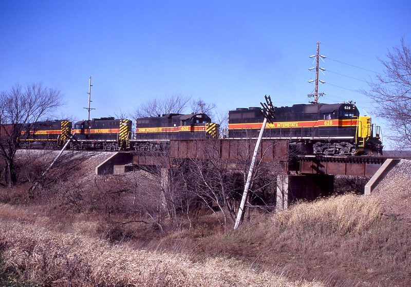 With a freshly painted nose, IAIS 628 leads CBBI over the old MILW right of way at Yocum Connection.  Photo by Will Rasmussen.