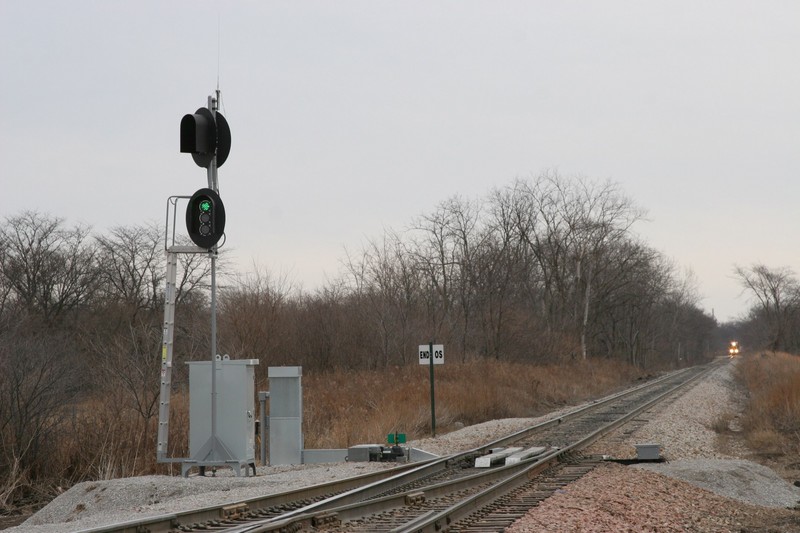 When a train approaches, they key up the radio and enter a code sequence.  The switch responds over the radio, reporting its alignment, and also clears the signal heads - all of them go green, no matter which way the switch is lined.