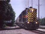 IAIS 401 East on RIPE-06 gets onto BNSF rails at 7th Street East Moline on 06-May-2004.  The IAIS mainline peels off to the left.