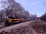 IAIS 468 West on BUSW-09 passes the left-over derailment debris at Colona on 09-Apr-2004.