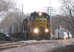 IAIS 483 West on BUNTXH-25 enters the BNSF at Colona on 25-Nov-2003.