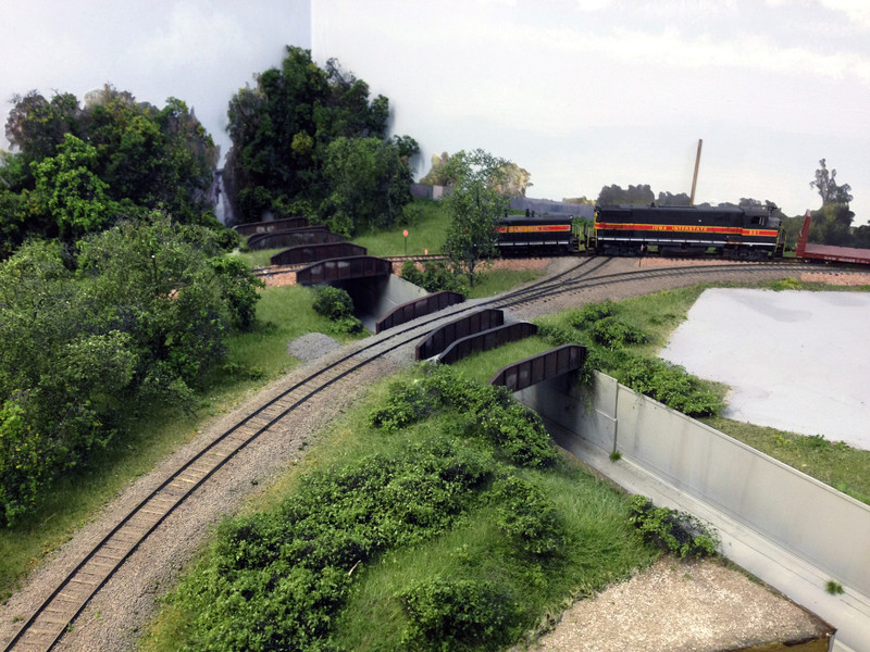 Indian Creek and the IAIS crossing of UP's 12th St. Line. From front to back, the five bridges represent the abandoned ex-CNW line into UP's North Pool Yard, UP's 12th St Line, the IAIS main (former RI WB main), and the abandoned ex-RI EB and MILW mains.