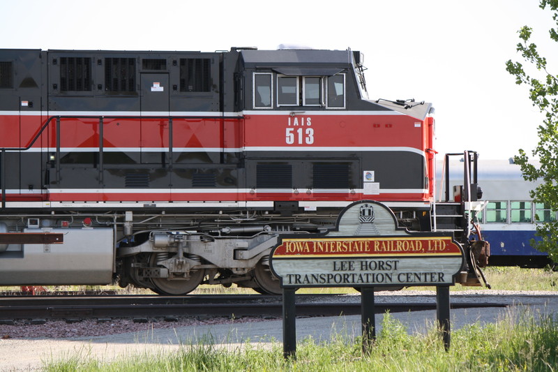 513 Poses next to the sign at Newtons Yard office on 5-18-10.