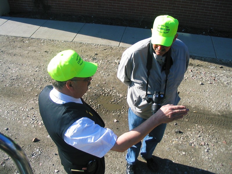 Car Hosts Don "Mr CGW" Vaughn and Meet Chair Dana Grefe discuss something before departing on the CNWHS Special on the IAIS To Atlantic