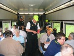 Car Host Don Vaughn punches tickets in the Abe Lincoln.