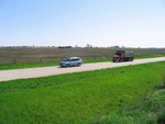 My Uncle Steve Kroeger in his van as he chases us along the White Pole Road between Stuart and Menlo