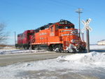 Railnet crew is heading east along their line into the Industrial park north of La Salle.