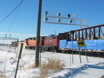 A BN coal train flies by on the main while Railnet pulls into the yard.  Looks like the old searchlight home signals don't have much lifetime left.