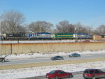 Cool Chicago Rail Link consist is stopped at the old main line 111th St. station, alongside I-57.  The Lastovich brothers are over there getting roster shots.