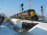 Approaching 191st St. east of Mokena.  The spur track in the background goes to Hines Lumber, served by CRL.  The signals are the westbound distant signals for the Mokena crossovers.