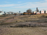 Bluffs switch crew is working the West Yard with 601 and the slug.  Anybody know (Joe, this means you) what those black covered hoppers are next to the building in the left background?