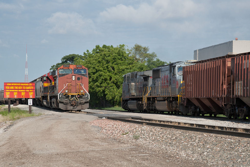 KCS 4609 heads west on the BN main with loads while BNSF 4727 holds with another set of KCS empties.  Rock Island, IL.