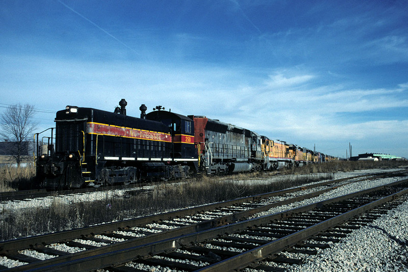 IAIS 250 shoves dead SP/UP locos into NRE @ Silvis, IL.  December 21, 2001.