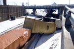 A reverse move gone wrong.  While shoving doublestacks under 24th Street in Rock Island, several of them didn't clear the bridge.  March 29, 2009.