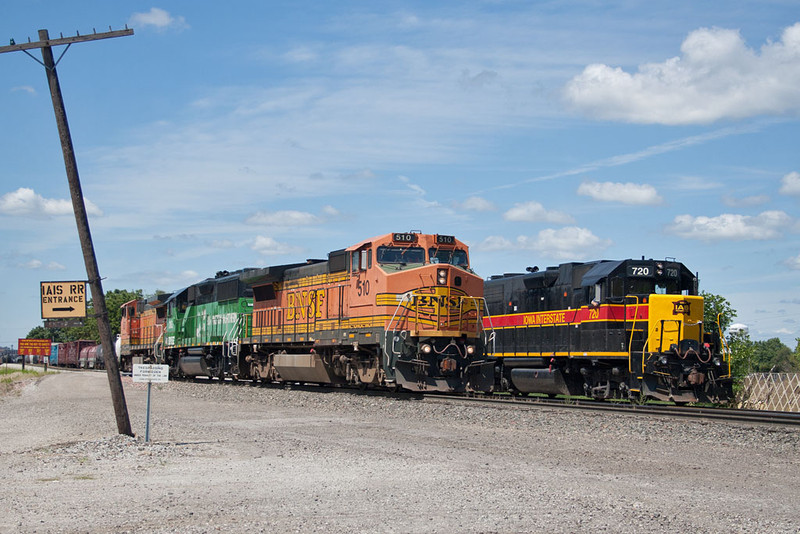 Light BNSF power passes IAIS 720 at 44th Street; Rock Island, IL.  August 10, 2011.