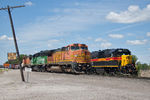 Light BNSF power passes IAIS 720 at 44th Street; Rock Island, IL.  August 10, 2011.