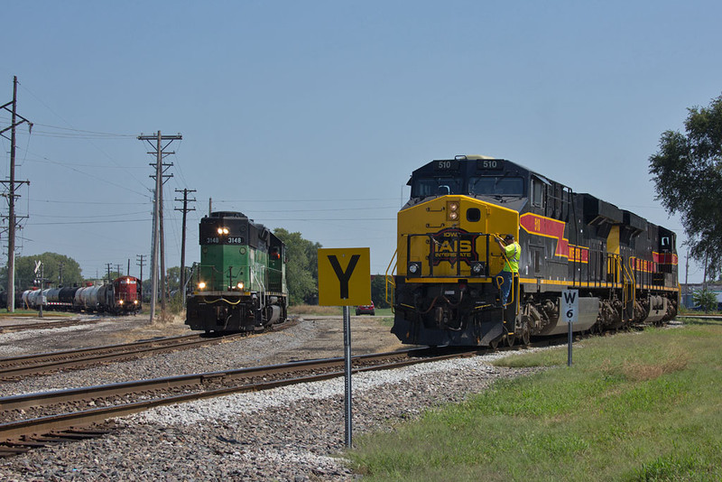 ICE 114 holds clear of 7th Street while the IAIS and BNSF prepare to swap interchange. East Moline, IL.  August 30, 2012.