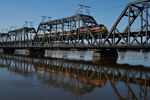 IAIS 717 & the business cars westbound on the Government Bridge; Davenport, IA.  July 11, 2012