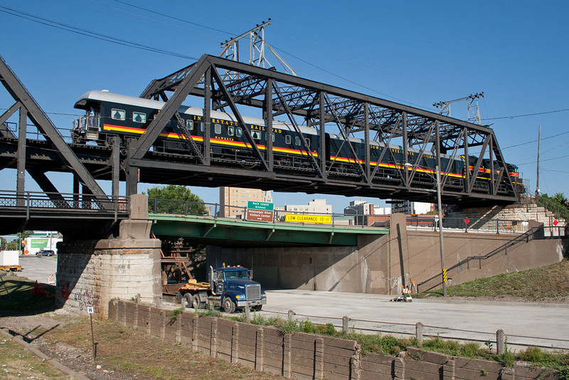 IAIS 717 & the business cars westbound on the Government Bridge; Davenport, IA.  July 11, 2012