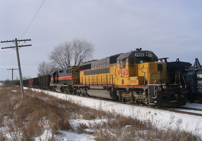 OHCR 9940 on CRPE @ Wilton, IA.  The crew is using IAIS 703 (lead engine) to switch JM.  December 11, 2005.