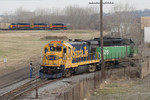 BNSF's R-CHI4271-15 derailed the lead axle on the 4234 while performing a switch move on the Illinois Oil spur in Rock Island, IL while CBBI sneaks into the yard with 702 up front.  Decmeber 15, 2006.