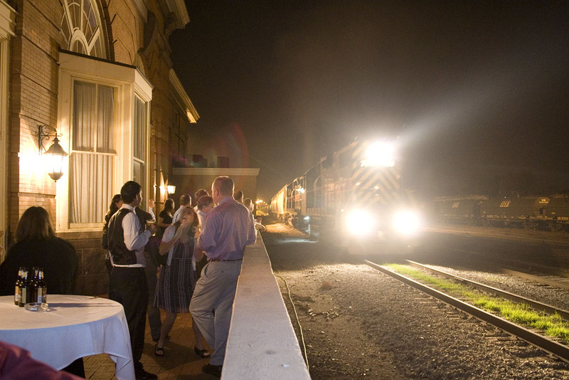 RISW-09 passes the Abbey Station during Will's wedding reception under the watchful eyes of the attending railfans.  Rock Island, IL.  October 9, 2010.