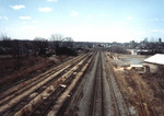 The IAIS yard in Iowa City looking west  from the Dodge Street Bridge. Notice to the left center of the picture is the old Rock Island engine house hidden in the shadows.