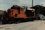 7976 getting service on the west end of the engine house. Note in the background the blue "ROCK" service truck with a big "R" Rock logo still partially visible on the door. This truck is still in use today painted orange. May 1985.