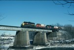 403, 464, ex-Milwaukee GP-20 962, and 466 cross the Iowa River Bridge in February 1989. I wonder if the guy fishing under the bridge ever thought his picture would be on the internet almost twenty years later?