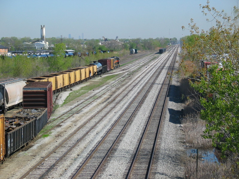 IAIS's tracks at RI's old Burr Oak yard, looking north from the 127th st. overpass.  On the right is Metra's fomer RI "mainline" to downtown.  The Sears Tower would be visible if I hadn't put it behind that sand tower back there!  April 26, 2006.