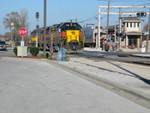 The crew has run the power around to the west end; here they've arrived at the Vermont St. Metra platform, preparing to back onto the train.  Note the former IC Metra Electric's Blue Island branch depot in the background.  Nov. 3, 2006.