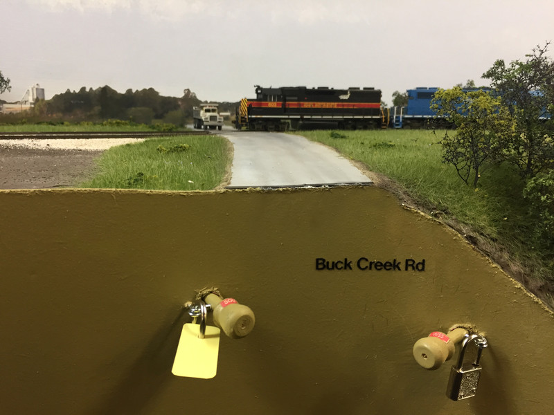 Switch locks were added using small screw eyes and luggage padlocks.  Locks without tags are for the Transportation Dept. (train crews), while yellow tags indicate tracks that are locked for Engineering (MOW) use only.