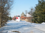 East train passes the WB home signal at Grinnell, Feb. 10, 2010.