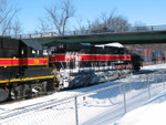 513 is parked under the Dodge St. overpass in IC yard after being cut off the EB.