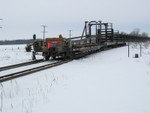 Rail train backs eastward through West Lib.  Pity the poor conductor who has to ride the point on a day like this!