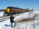 Railfans everywhere!  The turn is tied down at the west end of N. Star siding, while everybody's favorite Manager of Car Hire and Interline Switching shoots the approaching west train.  Feb. 23, 2008.