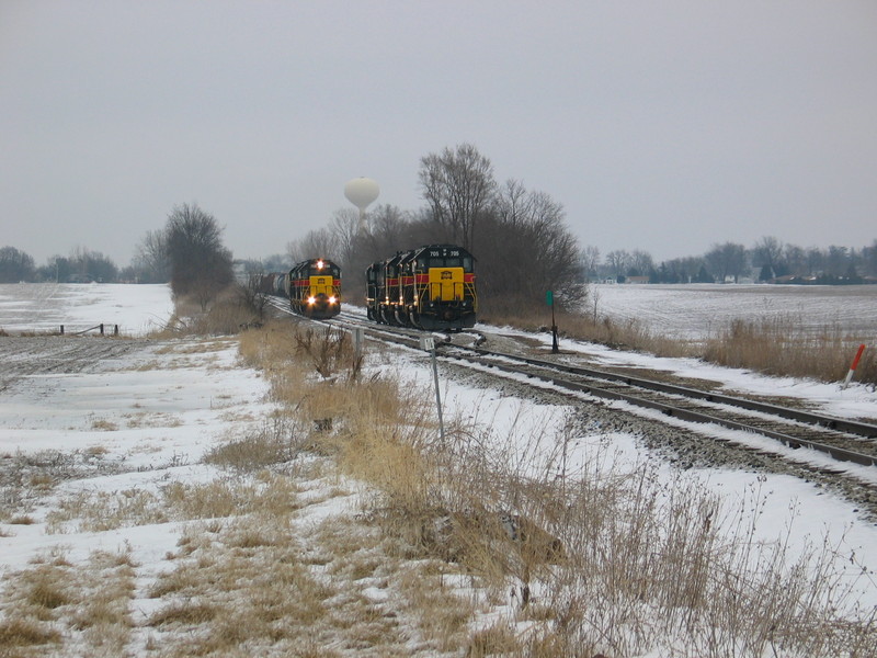 The westbound's crew has cut off their train east of town and is going to pick up the 4 engines off the west end of West Liberty siding, left there from an extra CR job.  Feb. 27, 2007.