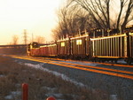 Pulling west down the siding at last light.