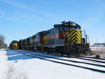 The westbound's crew has cut the power off their train and put it on the siding; the eastbound crew has cut off their 4 lead units and is tying onto the west train.  Feb. 8, 2007.