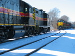 The RI crew has tied their 4 700s onto the head end of the east train and is pulling into the siding, while the westbound crew waits for them to clear.  Feb. 8, 2007.