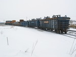 With their inbound loads parked on the inside track, the local runs around toward the main on the outside track.