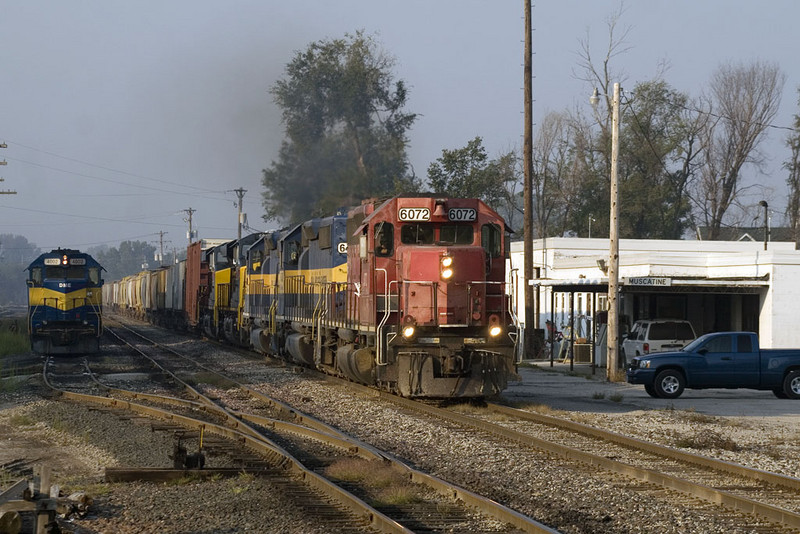 IC&E's MKCSP heads north past the yard office in Muscatine, IA with IAIS 507 and IAIS 509 in tow.  26-Sept-2008.