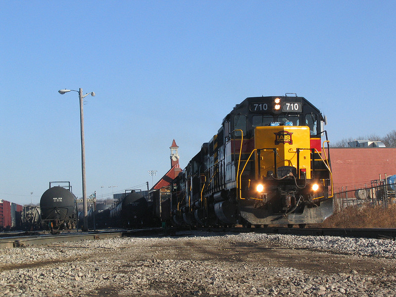 IAIS 710 West with a tardy BICB-13 head west down the "BN Industrial" at the west end of Rock Island yard.  14-Feb-2006.