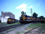 IAIS 325 West (PECR-28) arrives at West Davenport yard while IAIS 604 and friends wait to tie onto the rear and pull the train up to the mainline.  30-May-2002.