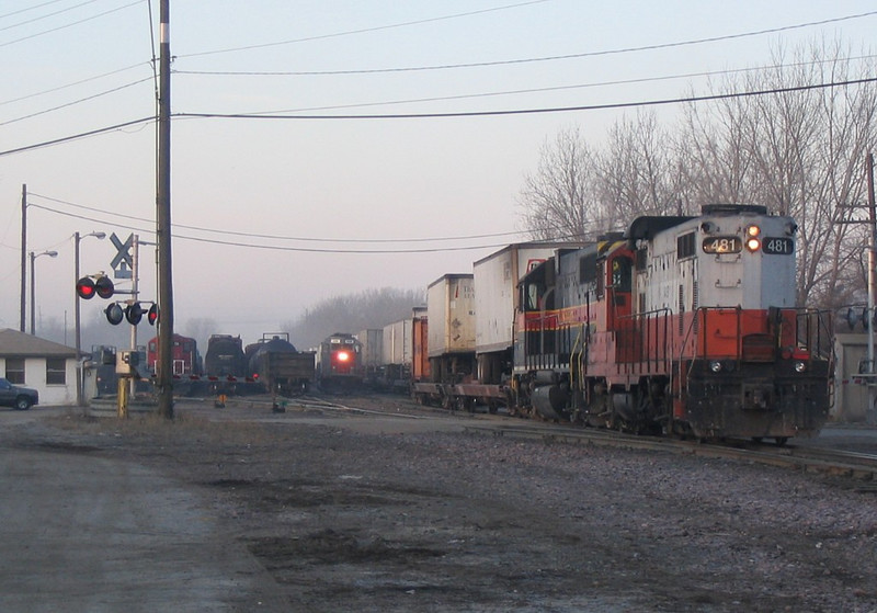 IAIS 481 is on the rear of the combined RIIC/BICB to pull the train back to the mainline.  West Davenport on 04-Mar-2005.