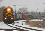 RISW-22 assists BICB-21 detour by pulling the train east down the "Golden State Route" from IC&E's West Davenport yard back to the mainline at Taylor Street.  Photo at Rockingham Rd; Davenport, IA on 22-Jan-06.