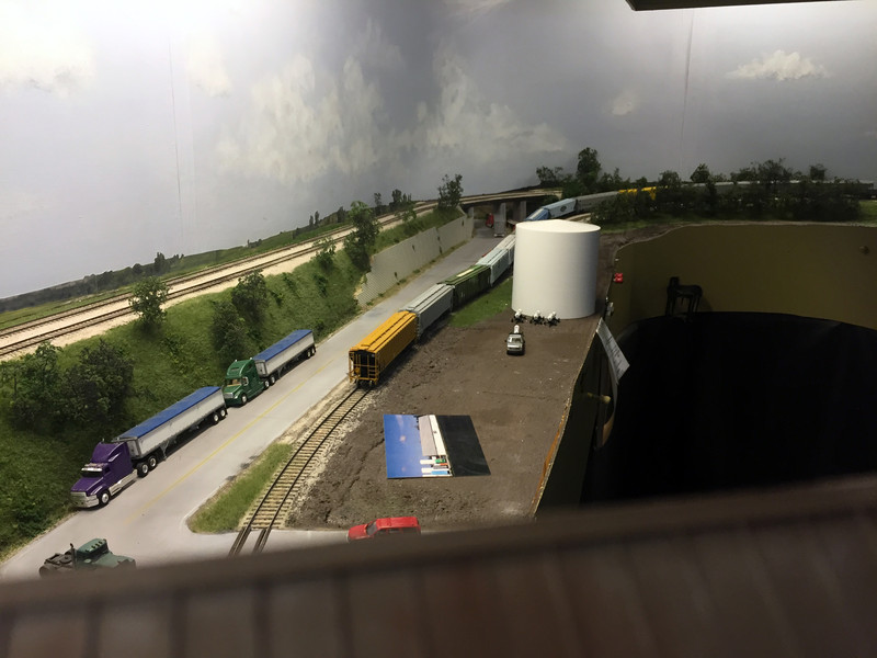 Looking south from the elevator at the hill tracks where the IAIS spots empties for Hancock. From left to right are the mainline and Hillis siding (on the fill), Hwy. 59, the Oakland branch, the Outside track (with the covered hoppers), and the Pocket track.